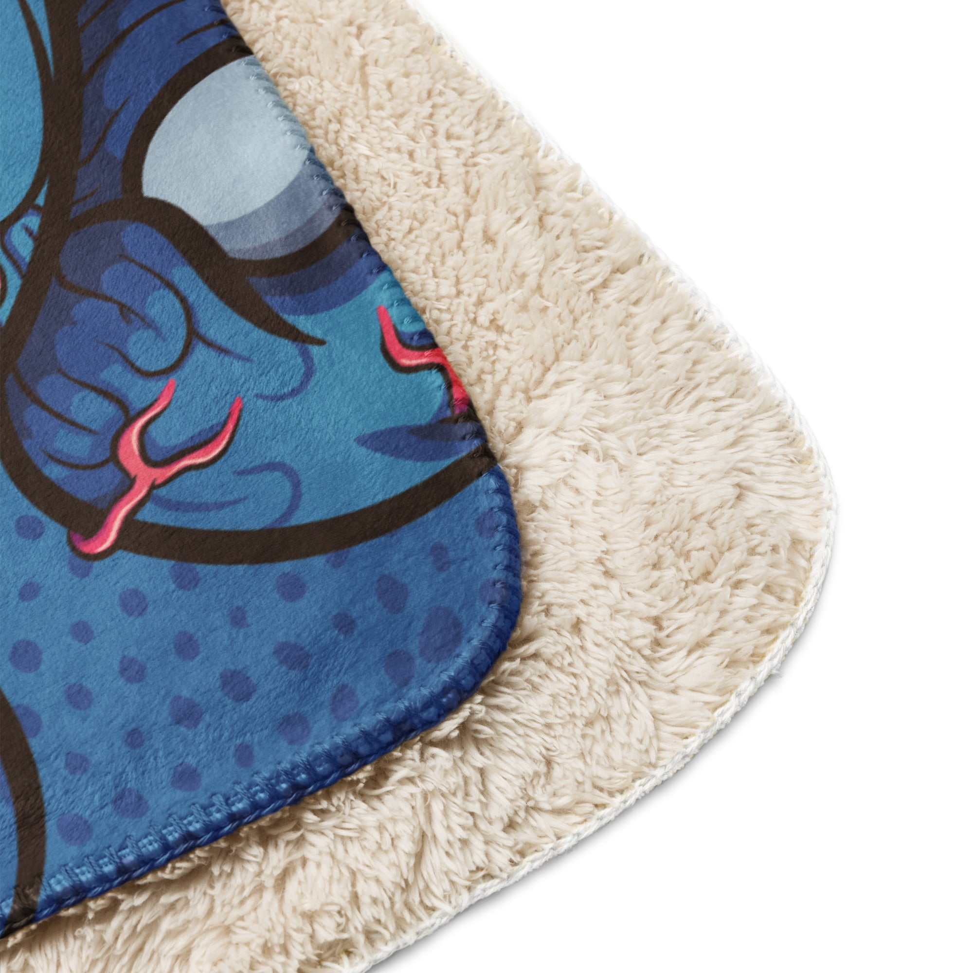 Folded Scary Teddy sherpa blanket showcasing its soft sherpa lining and bold monster graphic.