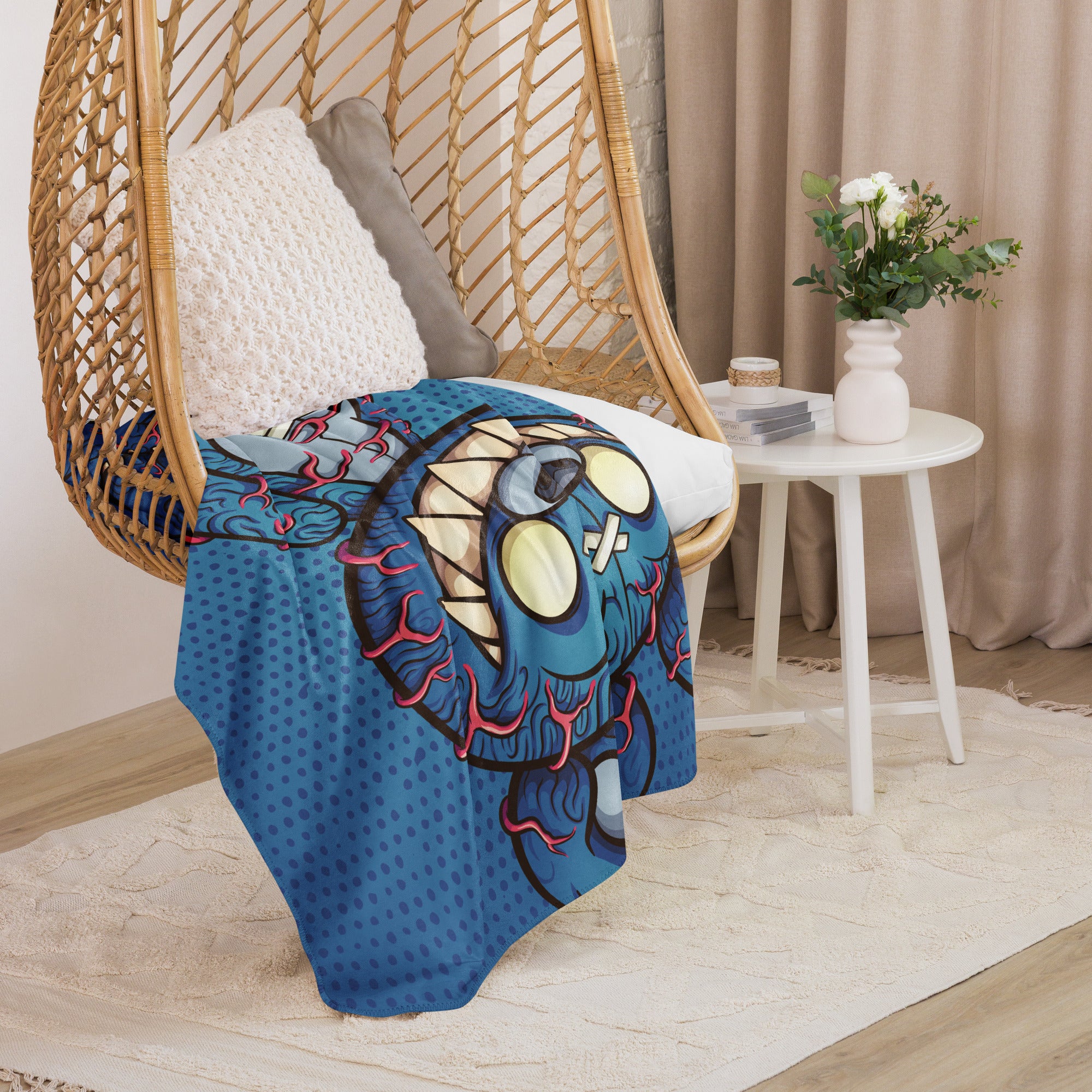 Scary Teddy blanket displayed on a chair with its vibrant design, adding a playful and cozy vibe to the room.