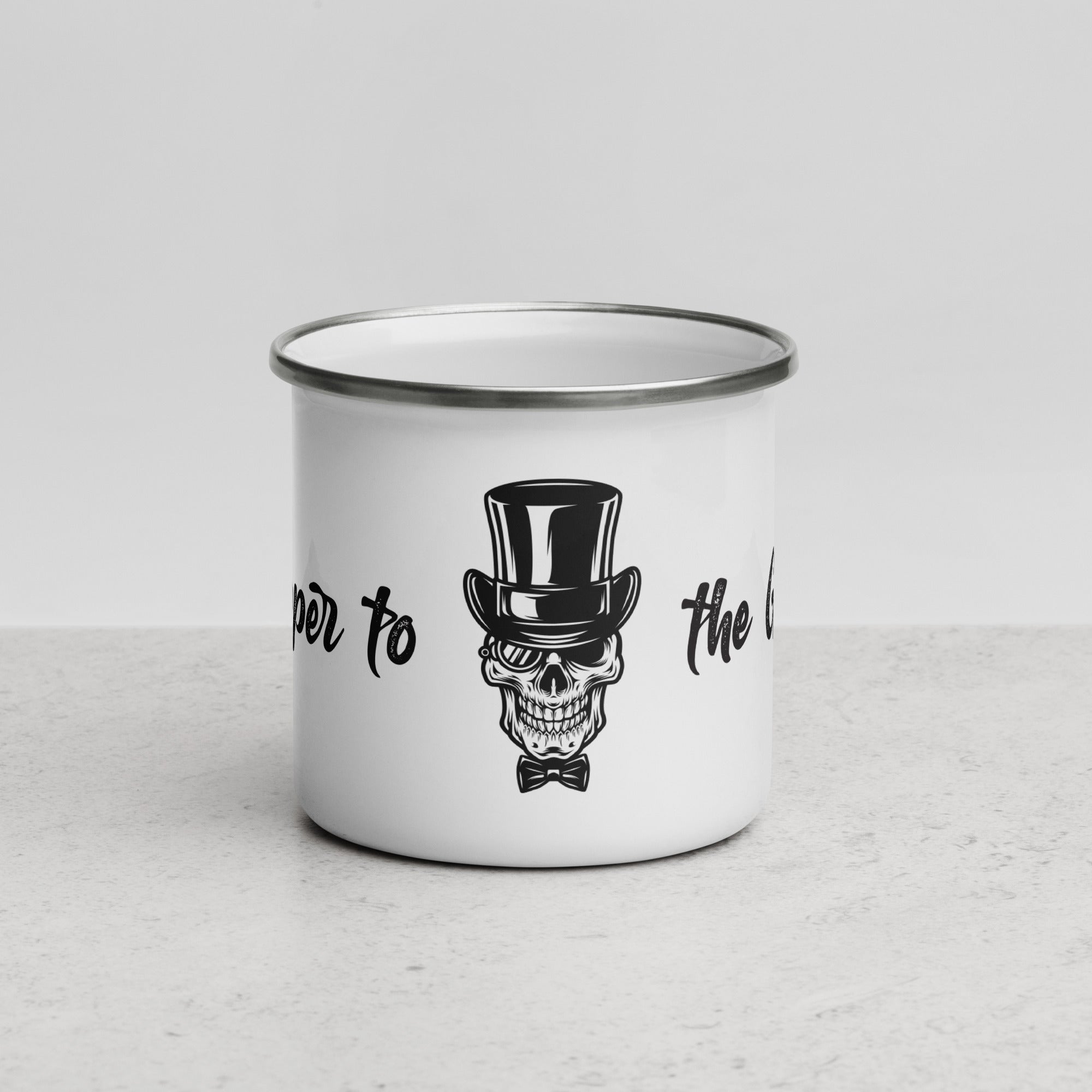 Close-up front view of the "Dapper to the Grave" enamel mug emphasizing the skeleton illustration.