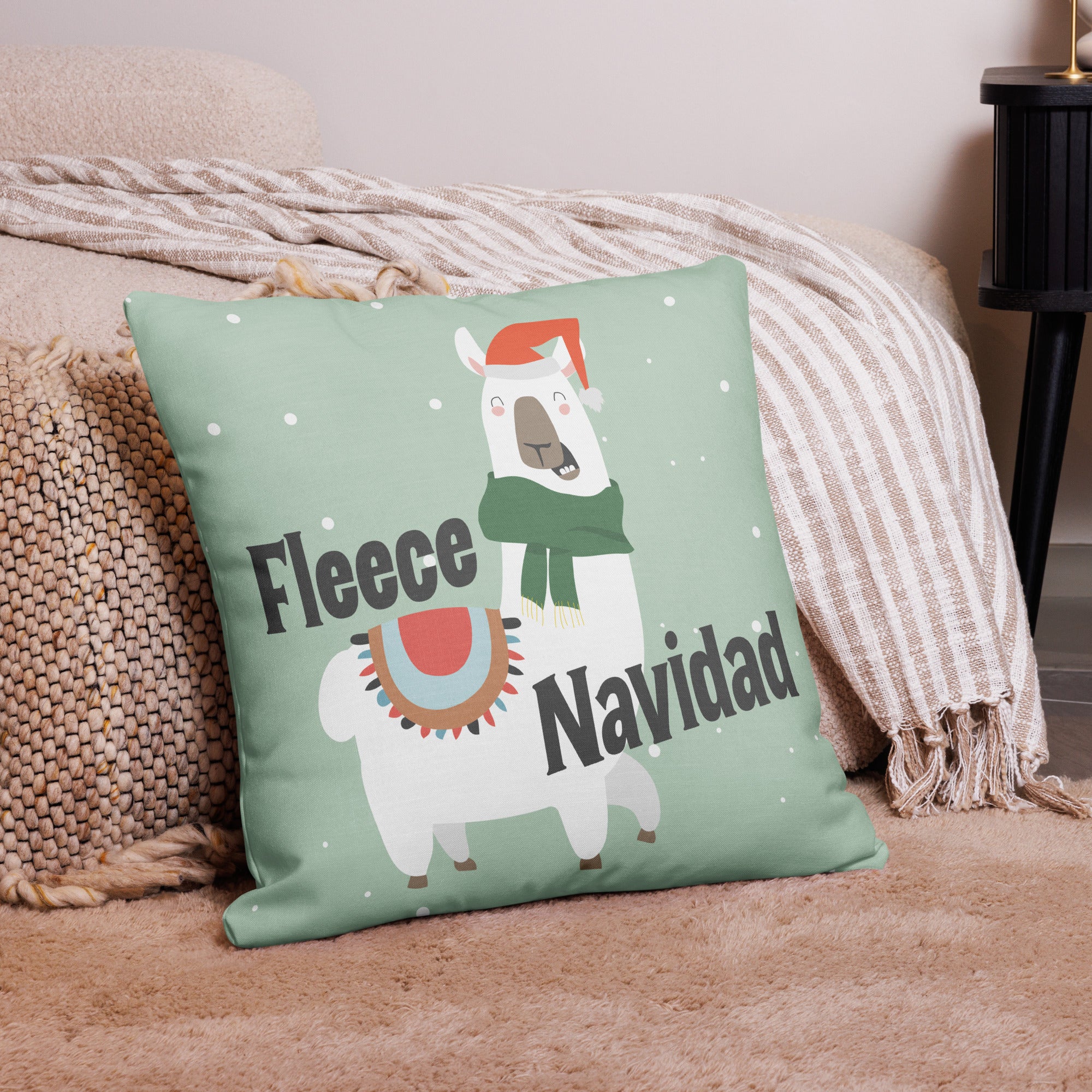 Playful Christmas pillow showcasing a festive llama and the words "Fleece Navidad," styled on a cozy beige rug with woven accents.