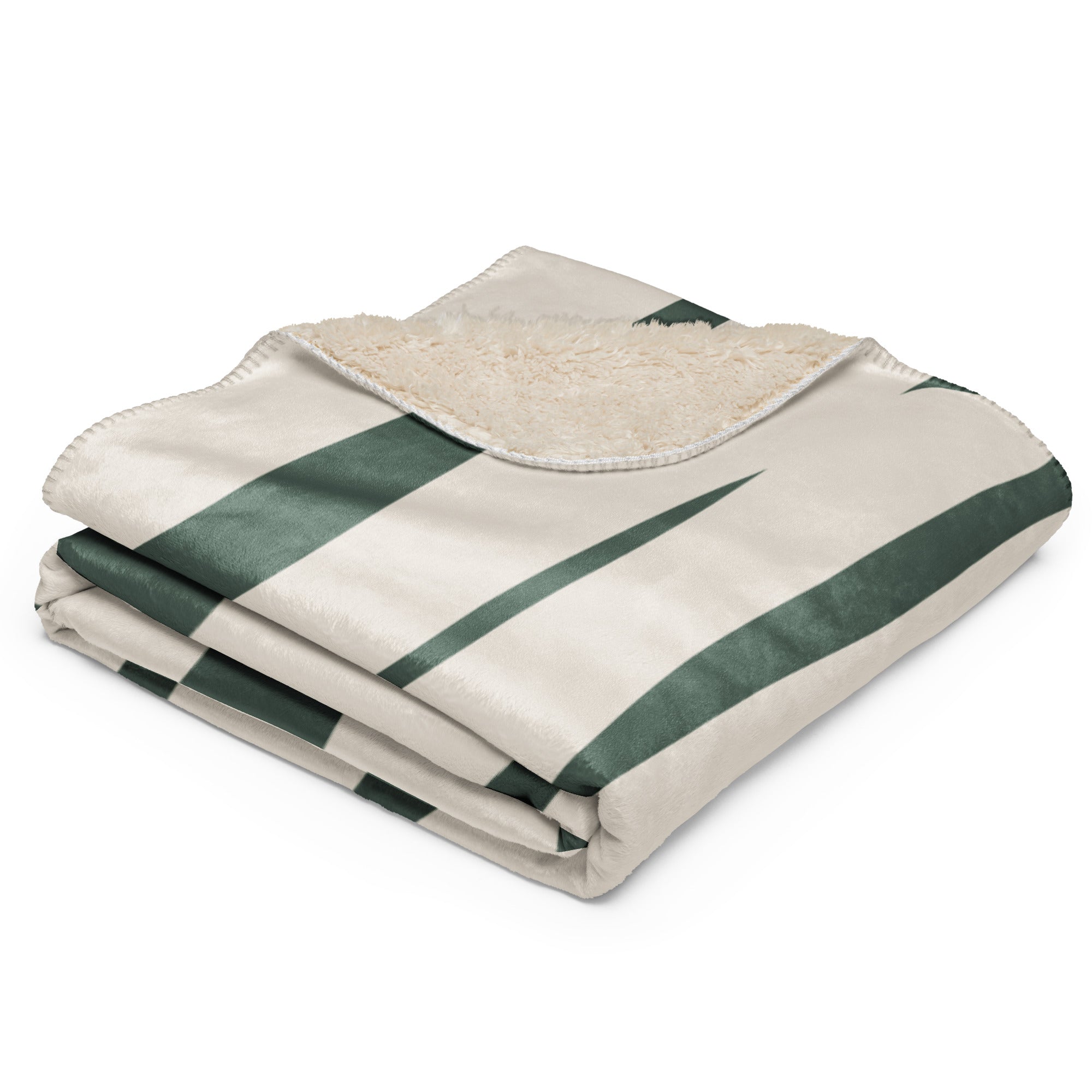 Folded sherpa blanket showcasing a green botanical print and ultra-soft lining.