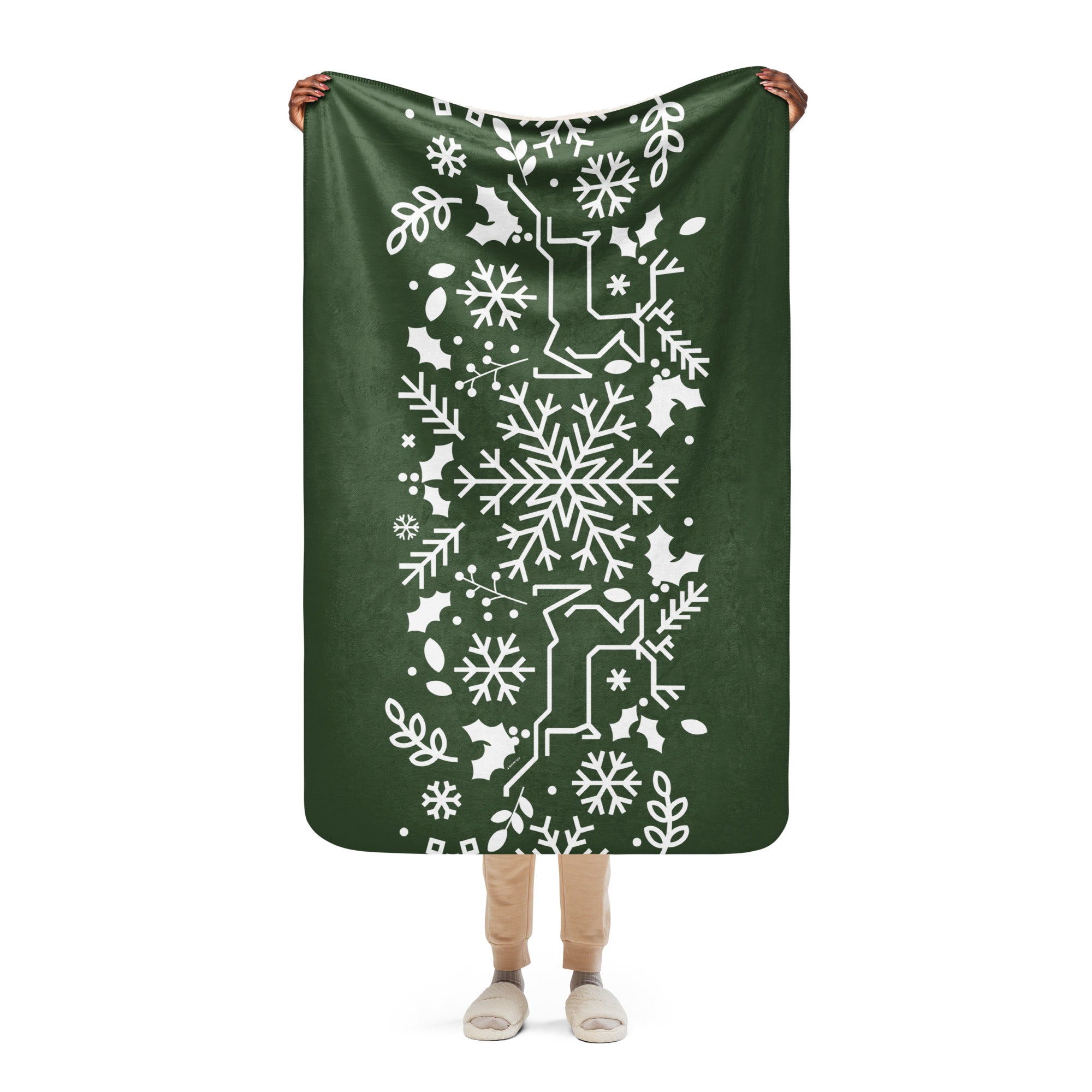 Full view of the Forest Green Sherpa Blanket, highlighting its snowflake and holly holiday design, perfect for seasonal decor.