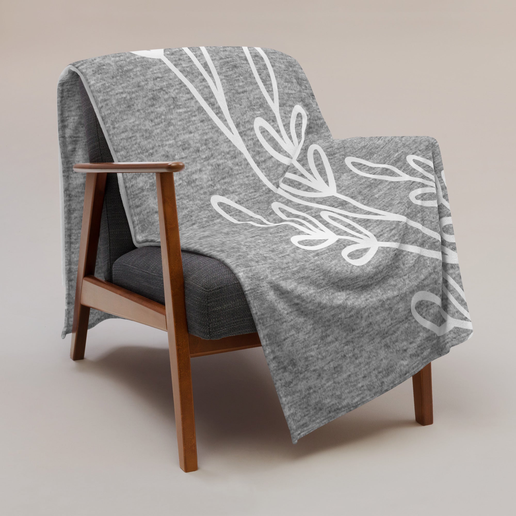 60x80 Gray Heather Leaf Throw Blanket elegantly draped in a neutral living room setup.