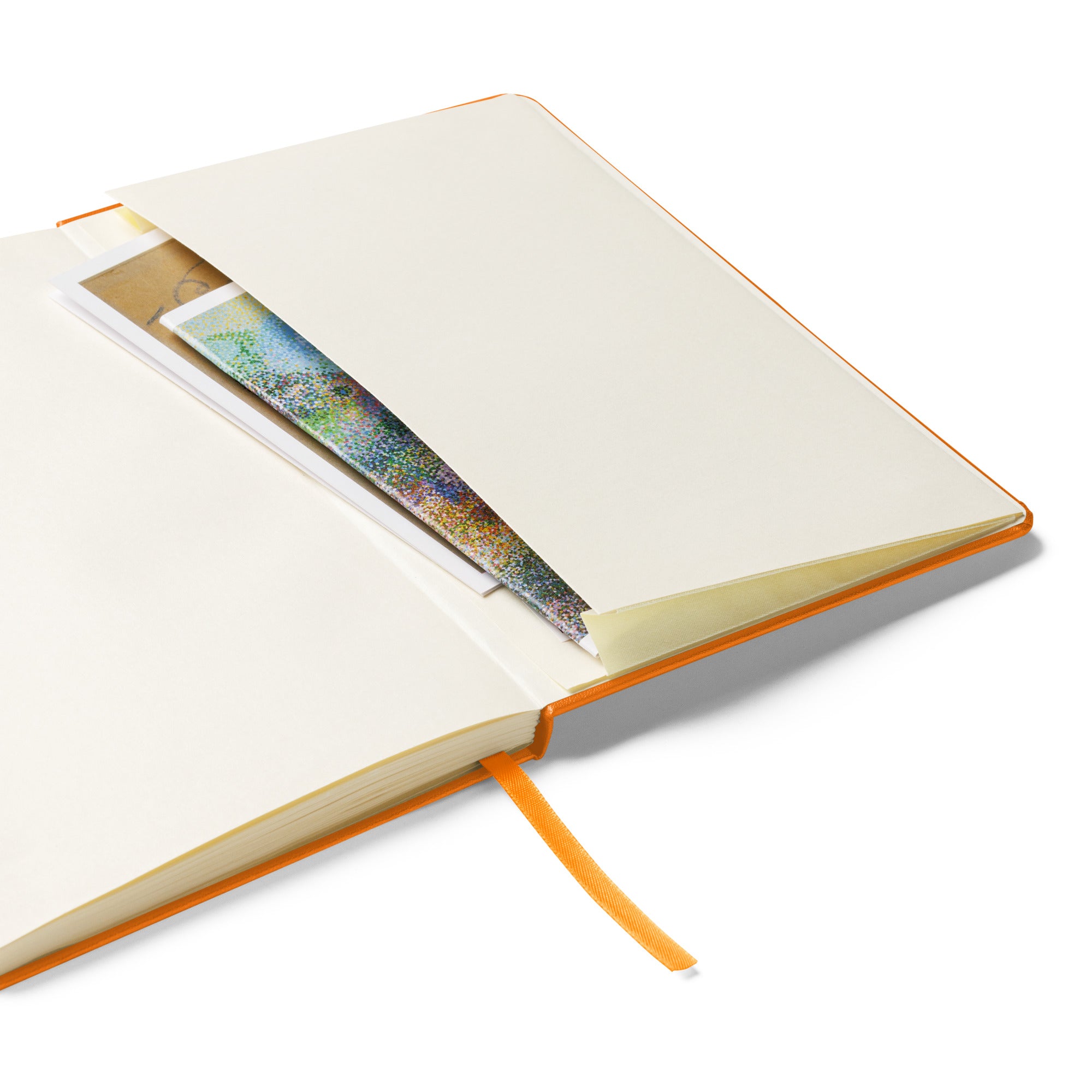 Expandable inner pocket of the 'Ink Flows Where Words Dare Not' Hardcover JournalBook® in orange, perfect for storing notes and keepsakes.