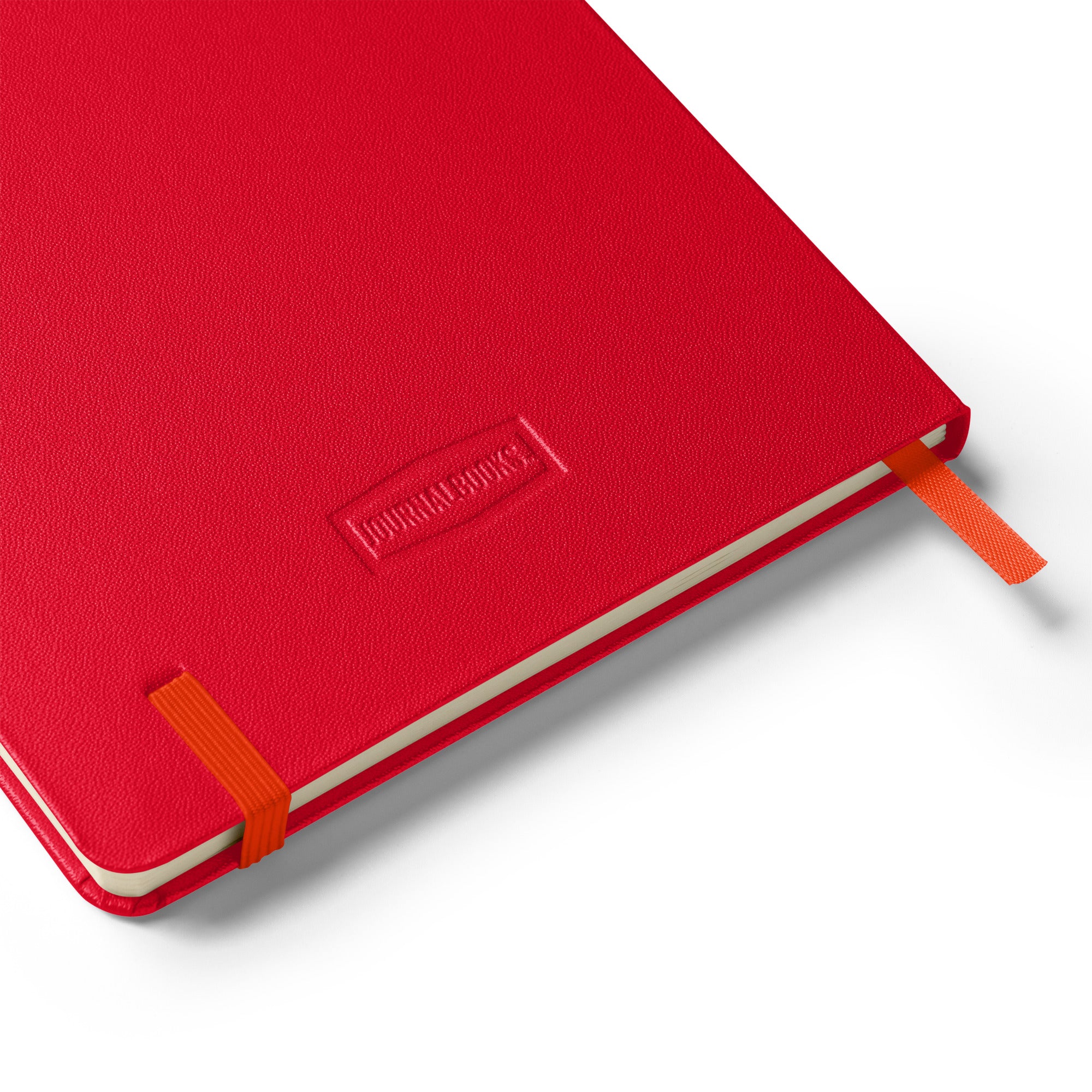 Back view of red "Don't be afraid to fail, be afraid not to try" hardcover notebook showcasing quality embossed branding.