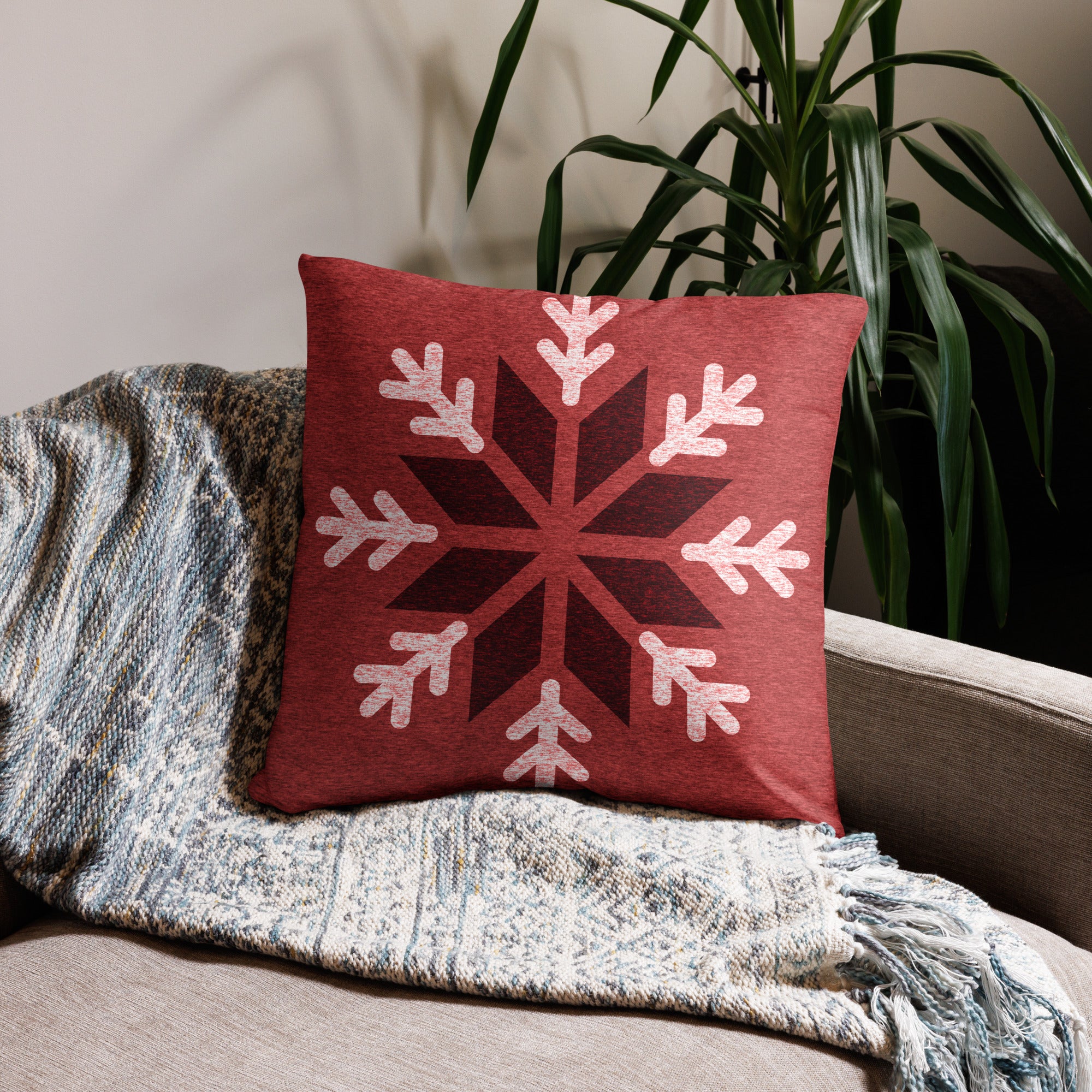 Front view of the Red Snowflake Holiday Throw Pillow with festive snowflake patterns in 22x22 size.